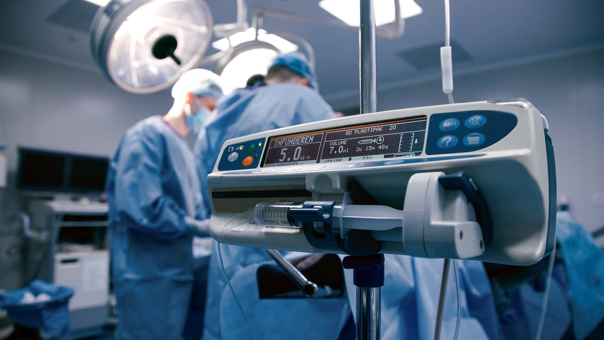 Surgical team performing a complex procedure in an operating room showcasing precision instruments and sterile environment